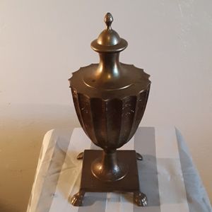 Urn- brass footed with ornamental brass top